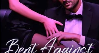 Bent Against The Counter Of His Desk
